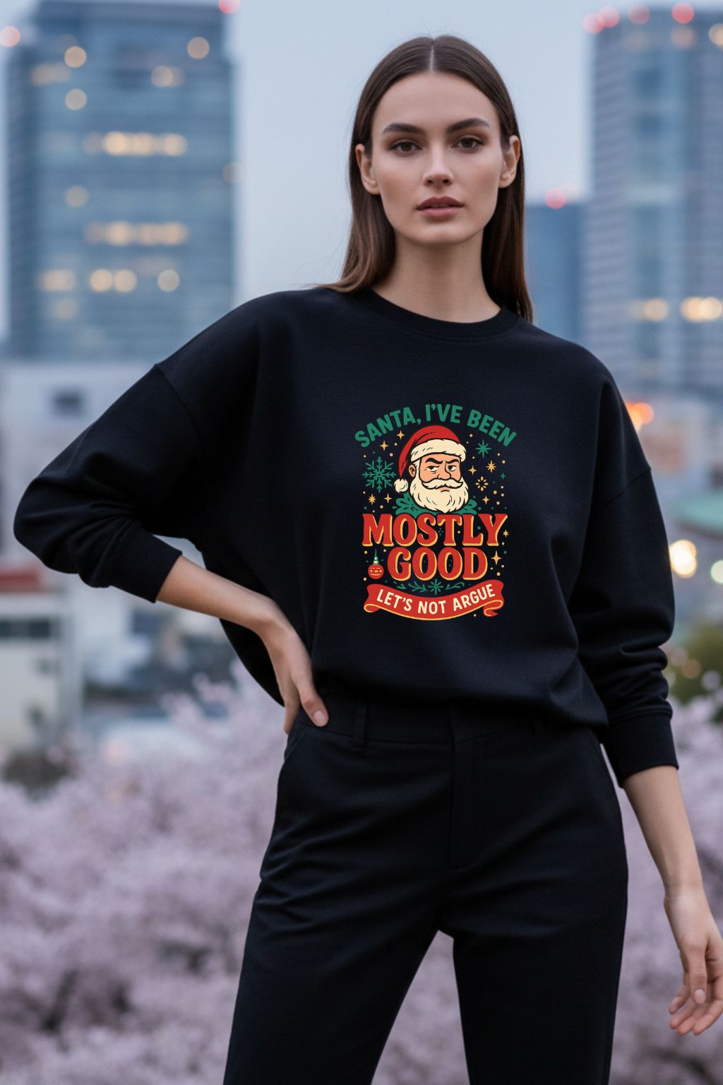 Woman wearing a black sweatshirt with a Christmas-themed graphic in an urban setting