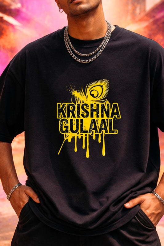 close up view of a man wearing a black oversized t-shirt with yellow 'Krishna Gulaal' design against a colorful background