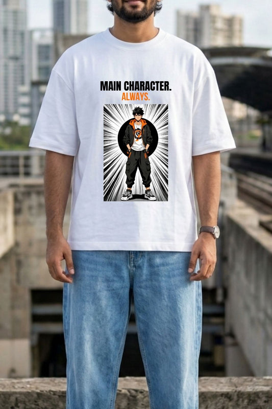 White unisex oversized t-shirt with bold anime graphic — "MAIN CHARACTER. ALWAYS." printed in black and orange — featuring a shonen-style protagonist in manga speed-line artwork, worn by a bearded man against an urban Indian cityscape background