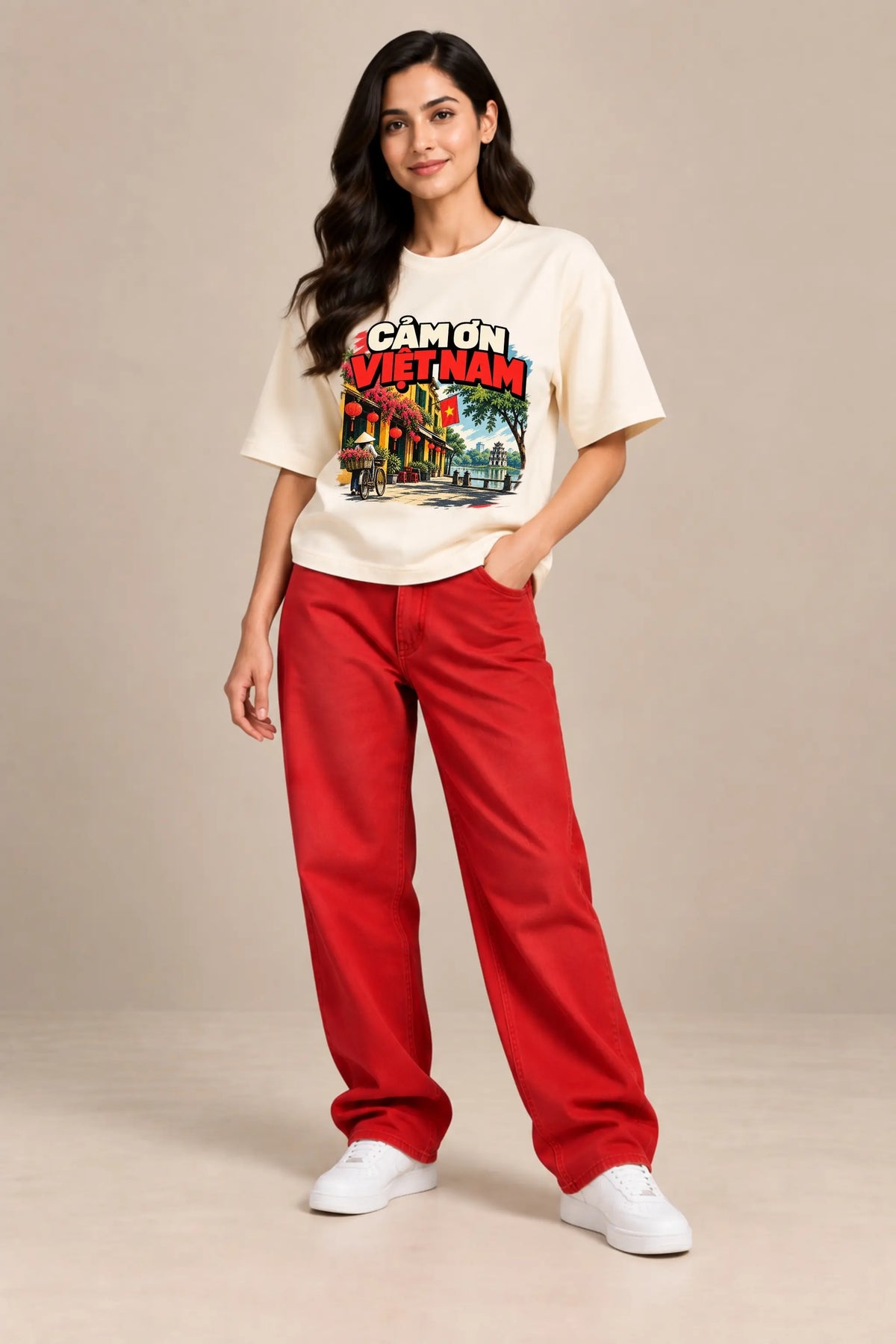 Woman wearing Cam On Vietnam — Gratitude Travel Oversized Terry T-Shirt in off-white with red jeans | JUNOSHI