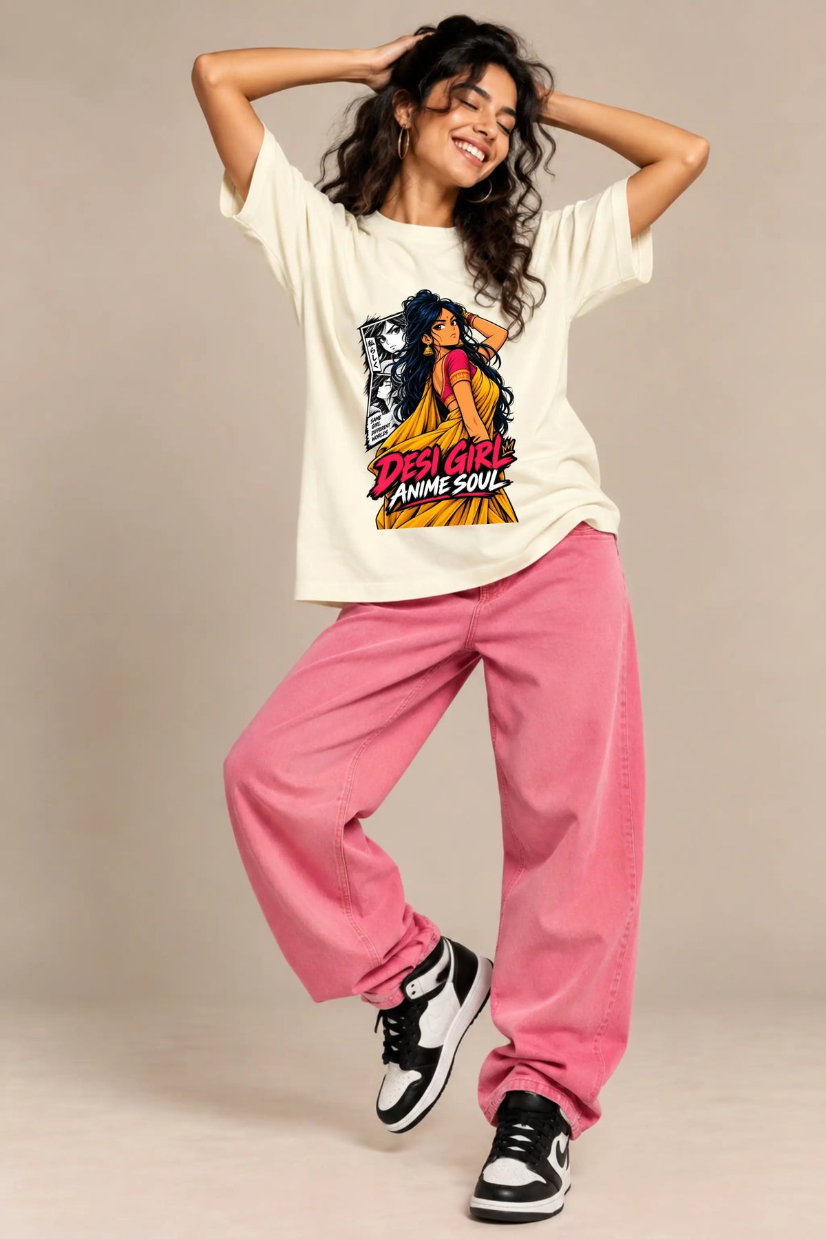 Woman smiling in Desi Girl Anime Soul off-white oversized terry t-shirt with pink baggy jeans, anime streetwear by JUNOSHI
