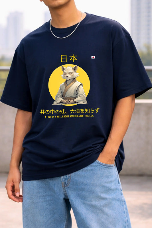 Close-up of Japanese kanji script and frog graphic print on navy blue oversized terry t-shirt — JUNOSHI