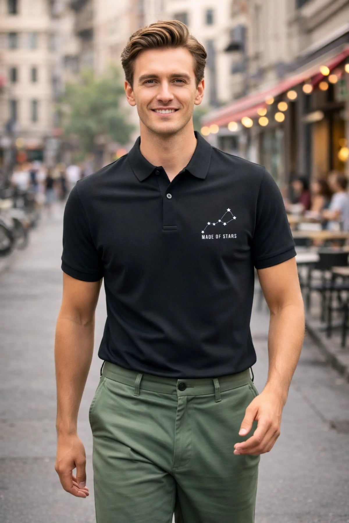 JUNOSHI Made of Stars black polo — man wearing constellation polo walking on urban street, smart casual street style