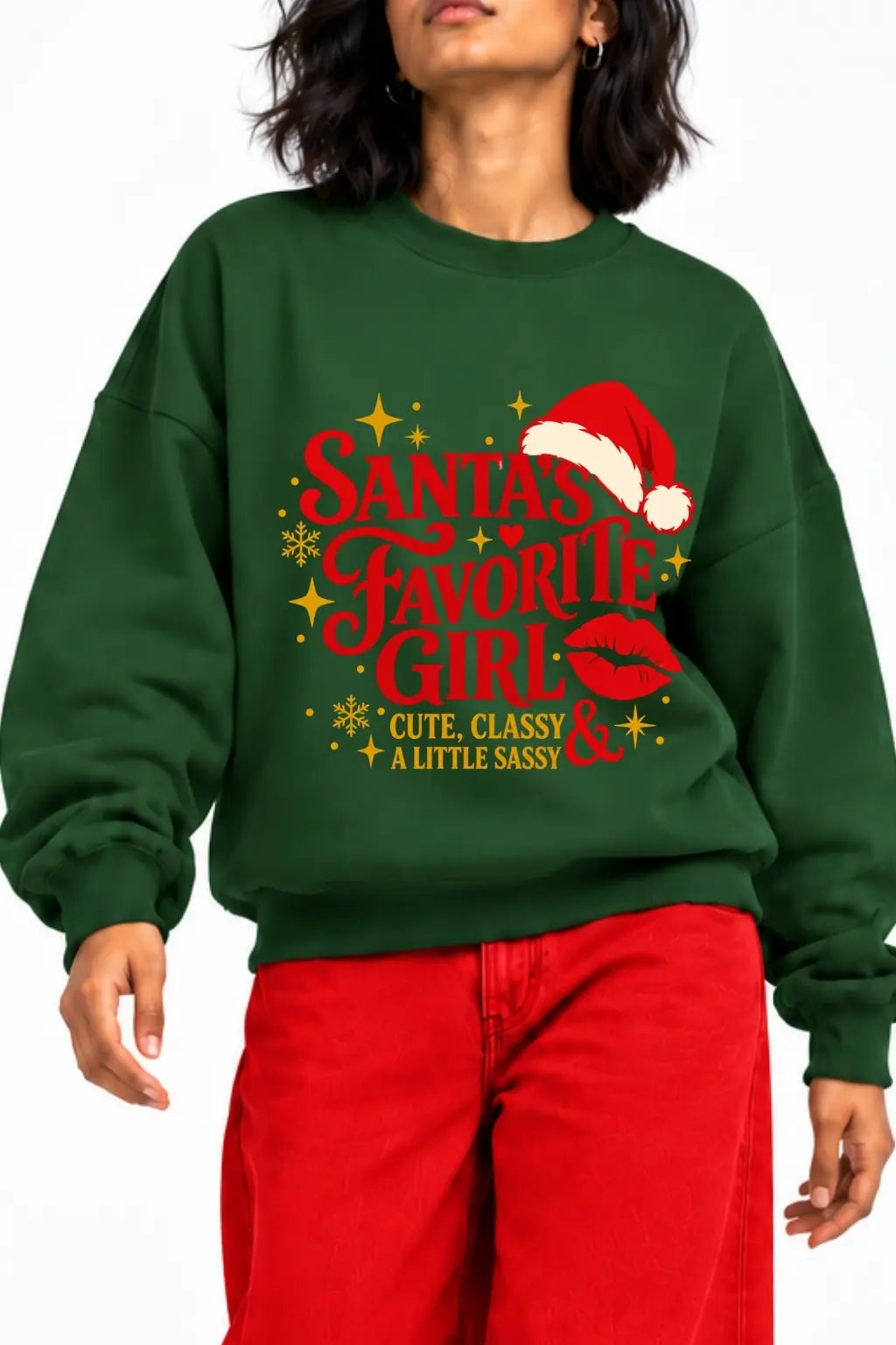 Close-up of Santa’s Favorite Girl Christmas sweatshirt print with Santa hat, red lips and gold snowflakes | JUNOSHI