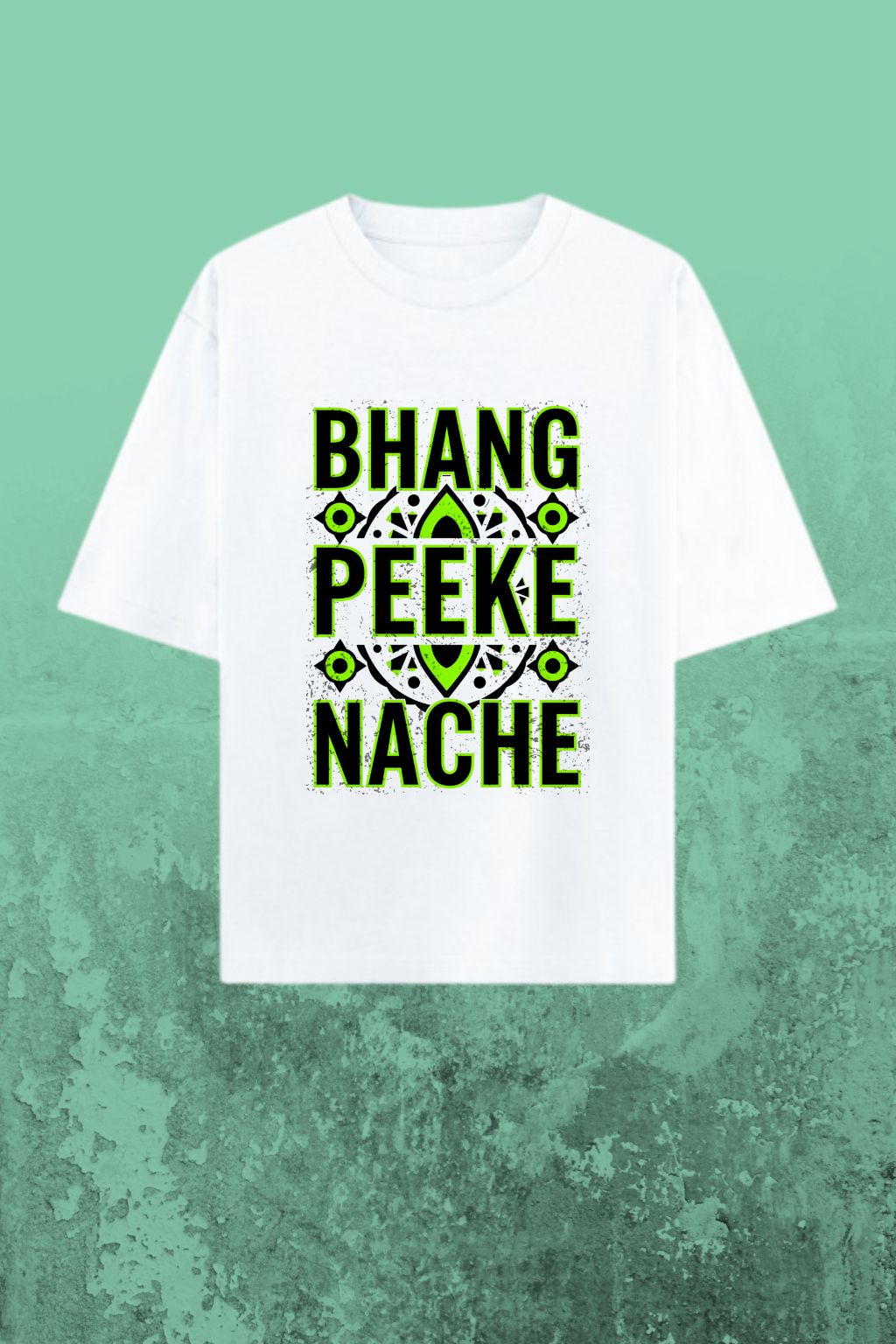 flat-lay view of a white oversized t-shirt with green text "bhang peeke nache" on a textured green background