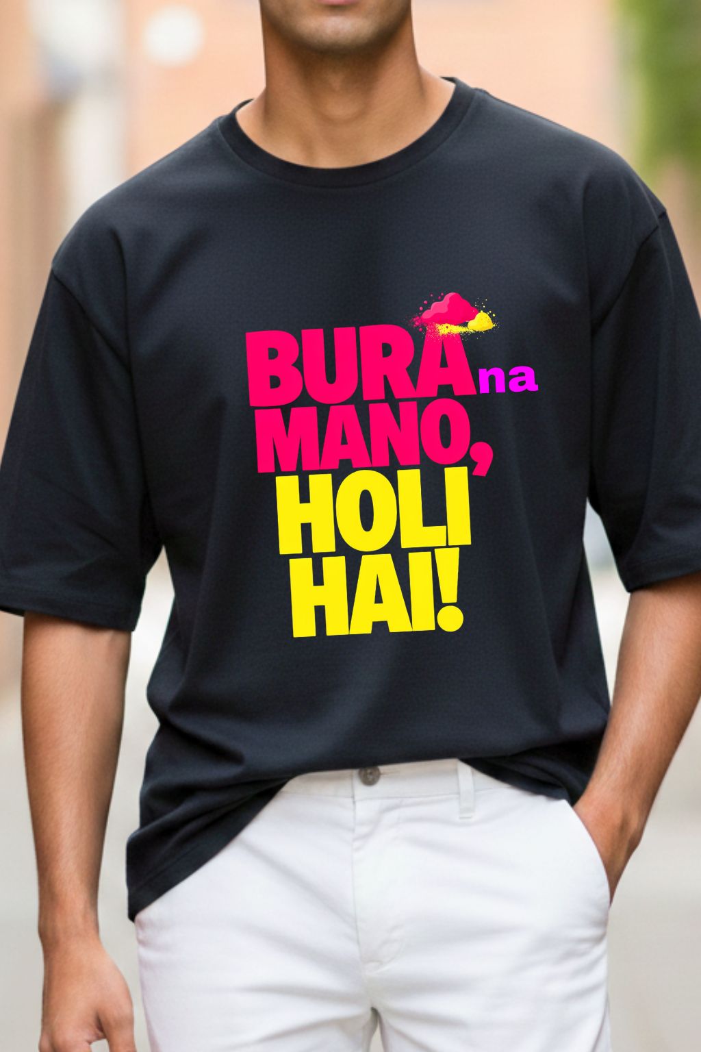 close up view of a man wearing a black oversized t-shirt with colorful text " bura na mano holi hai" and graphics.