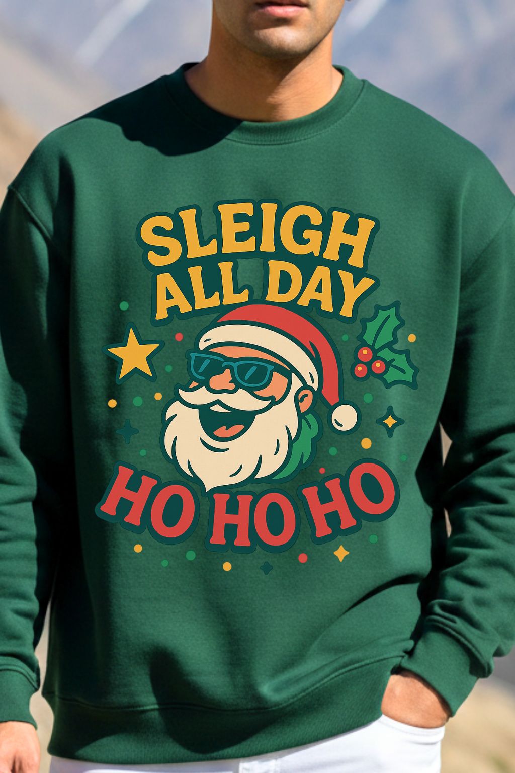 close up view of a man wearing a bottle green oversized sweatshirt with Santa Claus graphic and 'Sleigh All Day Ho Ho Ho' text.