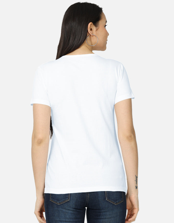 ZUPPI's "DJ Lakshmi Beats & Blessings" white t-shirt, back view. A woman wears the t-shirt with blue jeans, showcasing the design from the back against a white background.