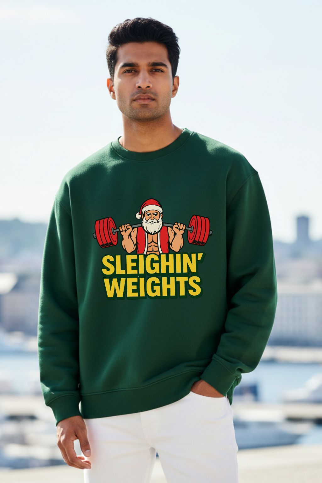 Man wearing a bottle green oversized sweatshirt with a Christmas-themed design outdoors.