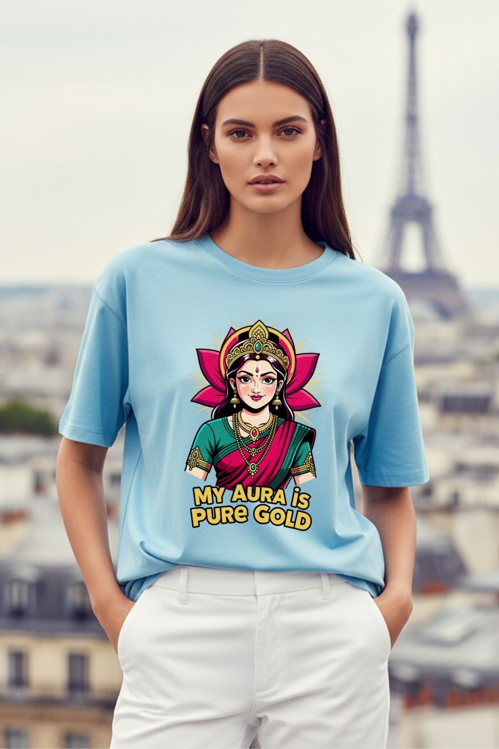 woman wearing a golden aura lakshmi design on a baby blue oversized t-shirt