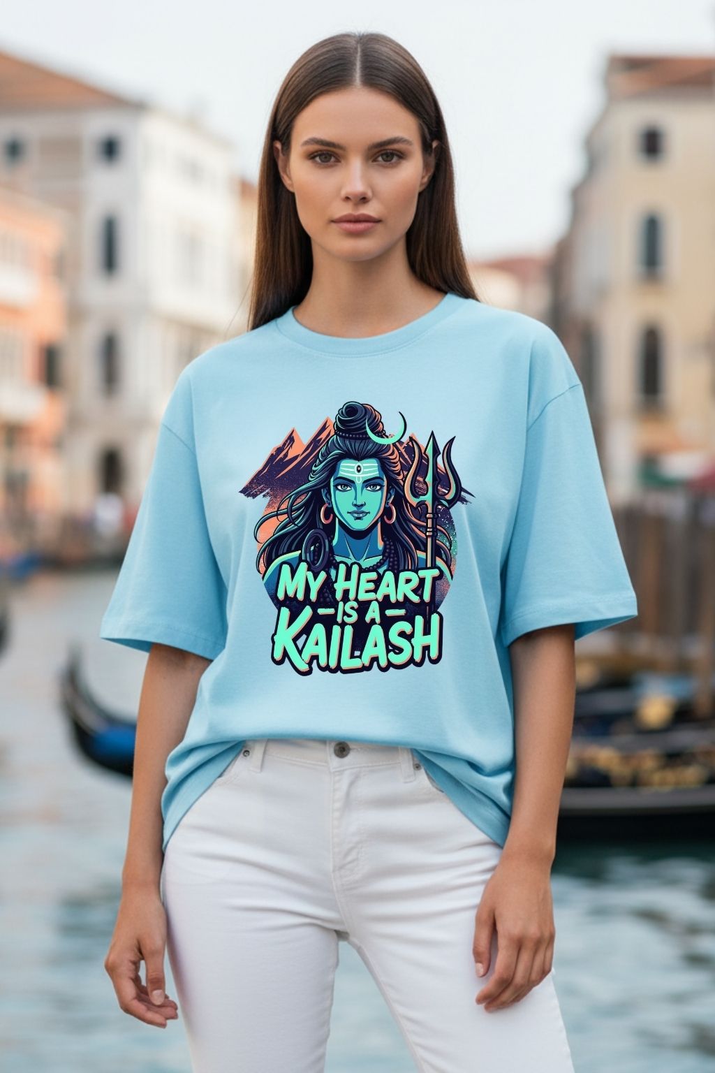 woman wearing a heart kailash design on a baby blue oversized t-shirt