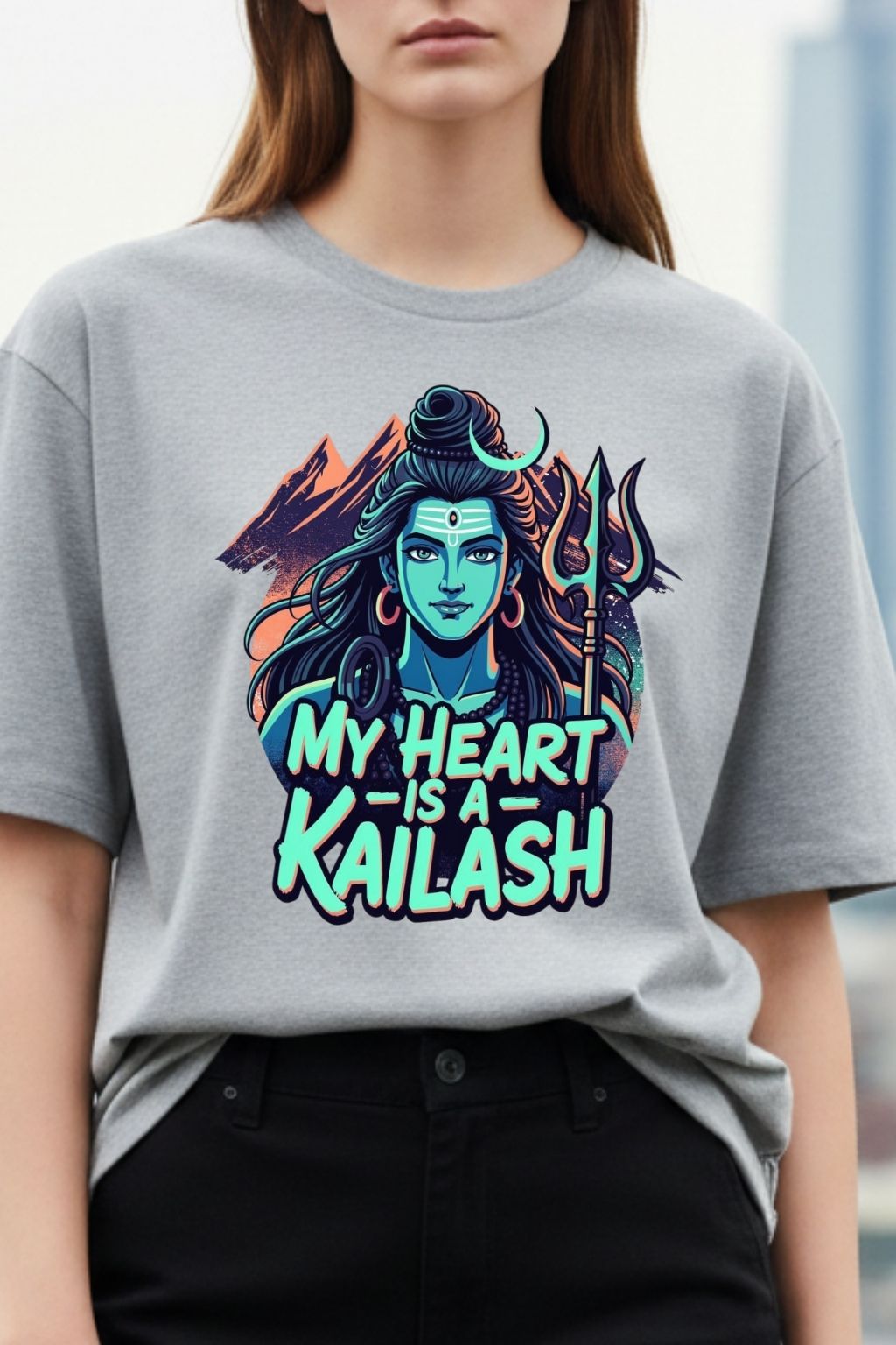 close up view of a woman wearing a heart kailash design on a light baby pink oversized t-shirt