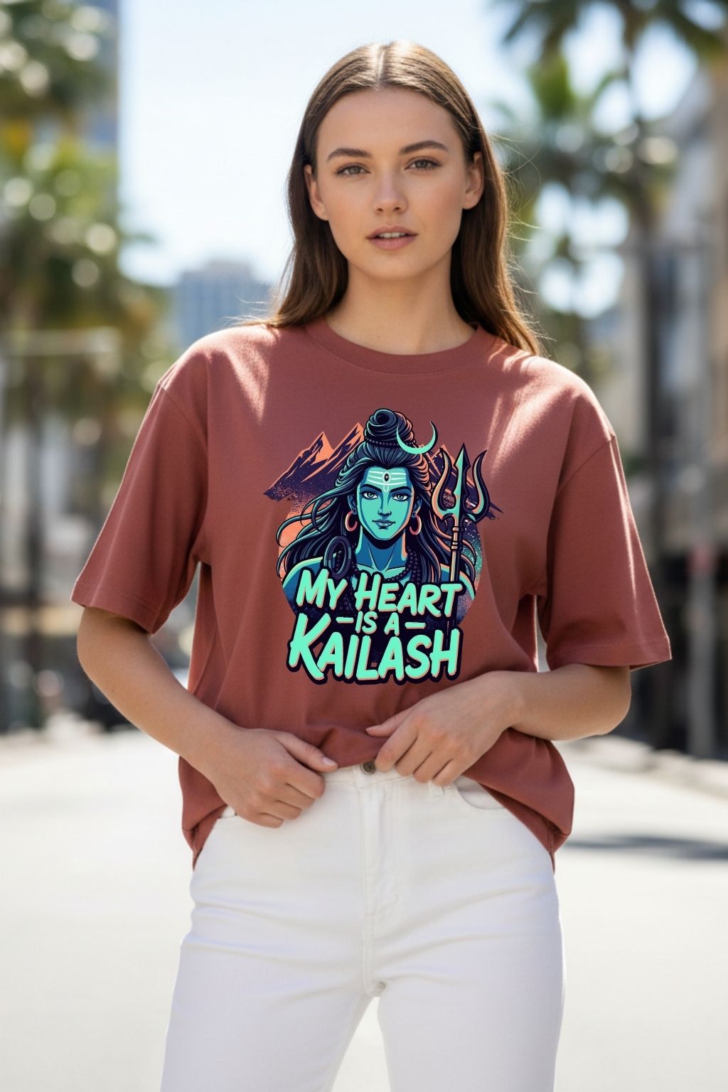 woman wearing a heart kailash design on a maroon oversized t-shirt