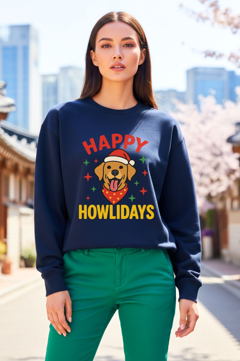 Woman wearing a navy blue oversized sweatshirt with 'Happy Howlidays' text and dog graphic, standing outdoors.
