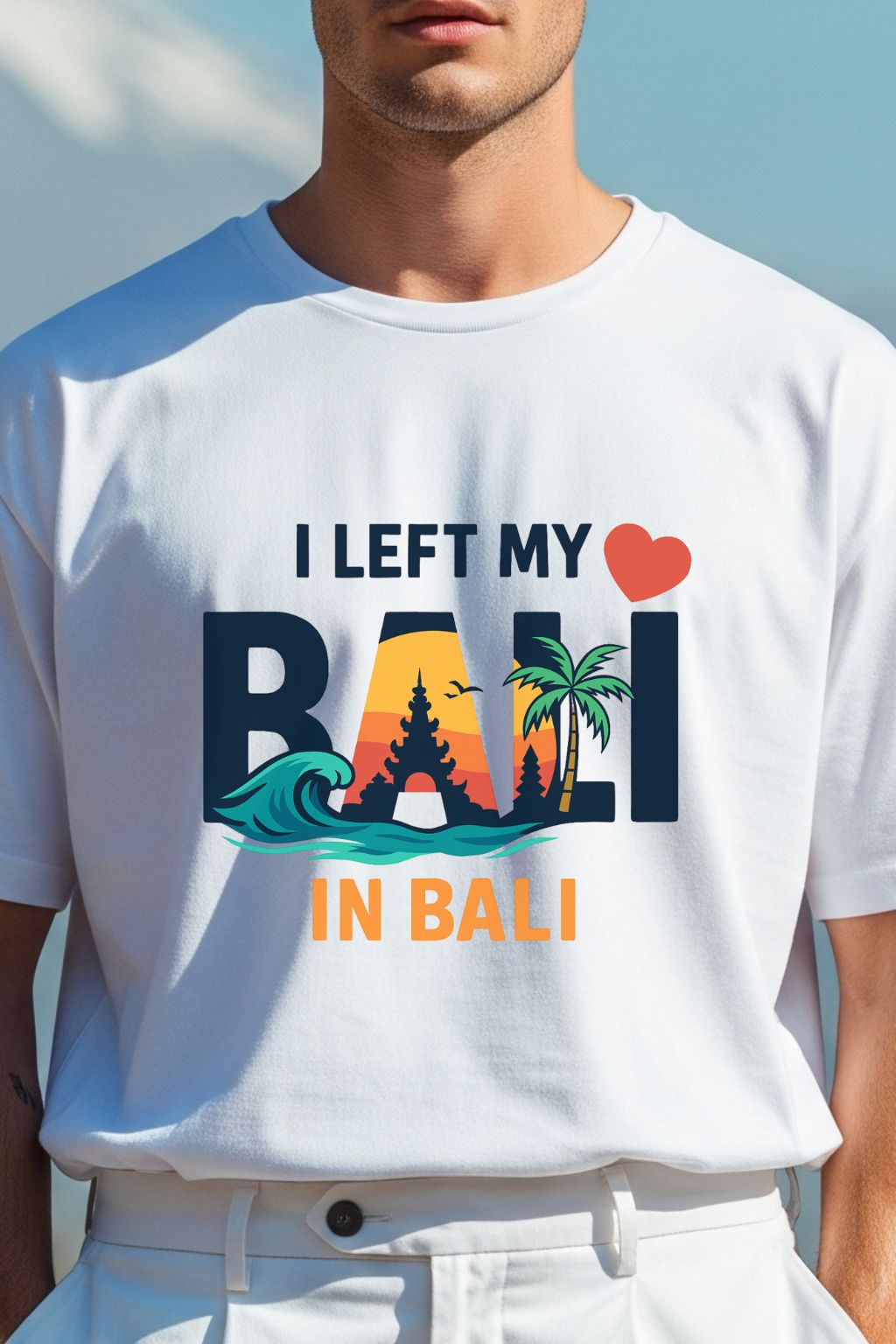 Close-up of I Left My Heart In Bali chest graphic on white oversized t-shirt — Balinese temple, ocean waves, palm tree print detail — JUNOSHI