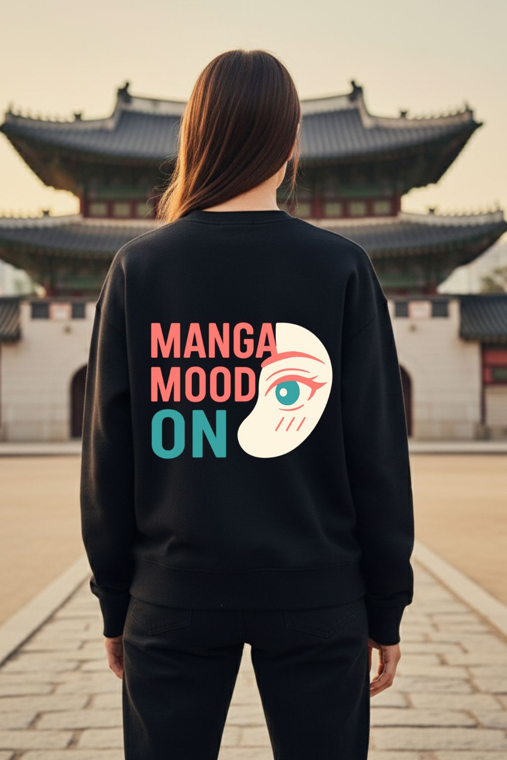 back view of a woman wearing black anime graphic oversized sweatshirt with Otaku Mode kawaii design and Japanese text, standing in front of traditional Asian architecture — ZUPPI