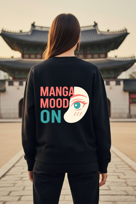 back view of a woman wearing black anime graphic oversized sweatshirt with Otaku Mode kawaii design and Japanese text, standing in front of traditional Asian architecture — ZUPPI