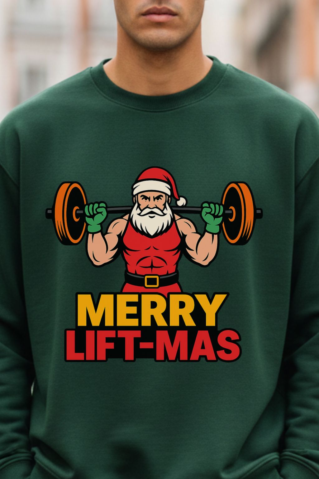 close up view of a man wearing a bottle green oversized sweatshirt with Santa Claus lifting weights and 'Merry Lift-Mas' text.