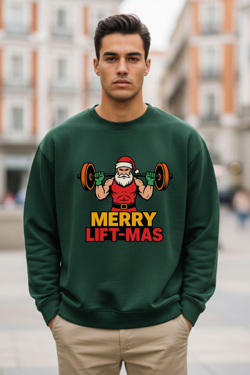 Man wearing a bottle green oversized sweatshirt with a Christmas-themed graphic and text.