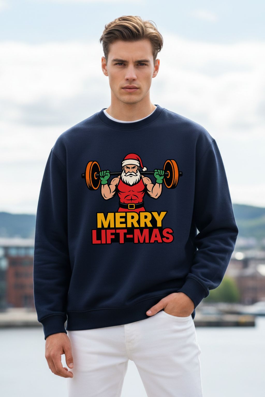 Man wearing a navy blue oversized sweatshirt with a Christmas-themed graphic of Santa Claus lifting weights, standing outdoors.