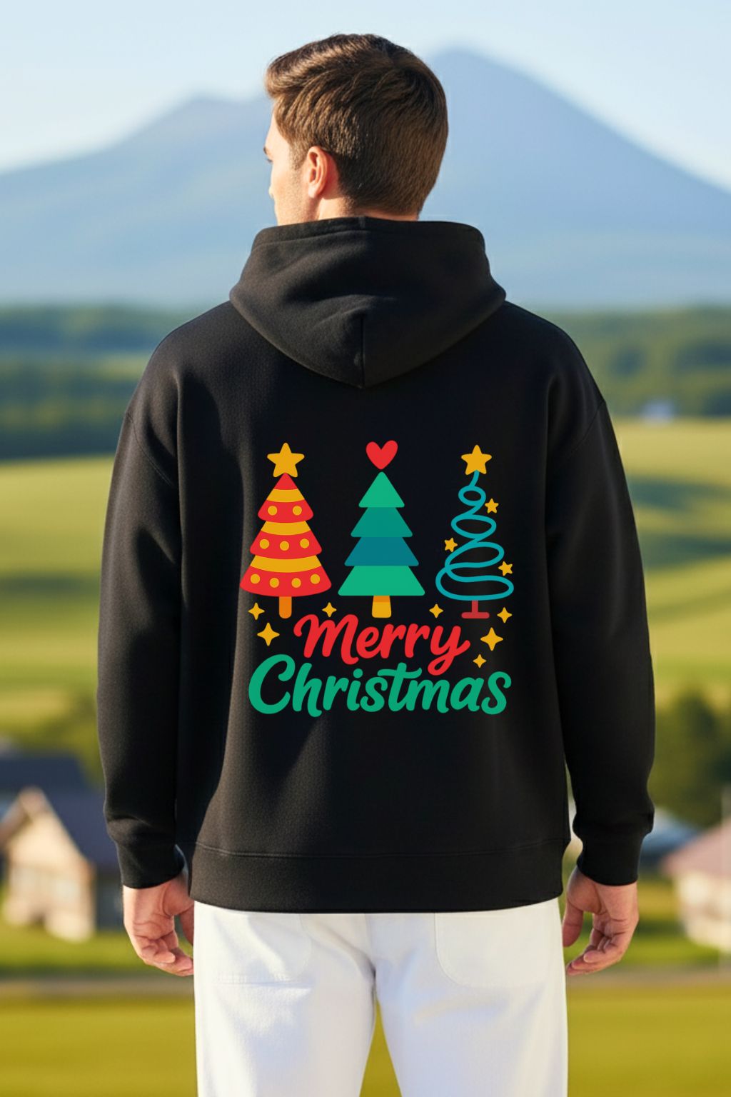 back view of a man wearing a black oversized hoodie with colorful Christmas design outdoors