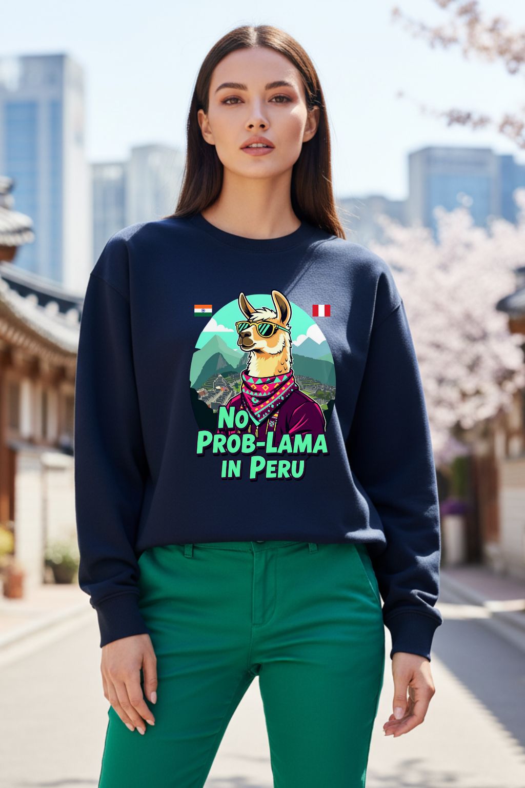 Woman wearing a navy blue oversized sweatshirt with a graphic design and text, standing outdoors.