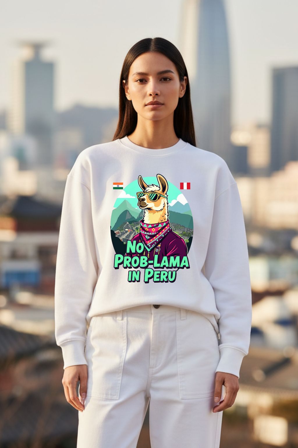 Woman wearing a white oversized sweatshirt with a llama graphic and text, standing in an urban setting.