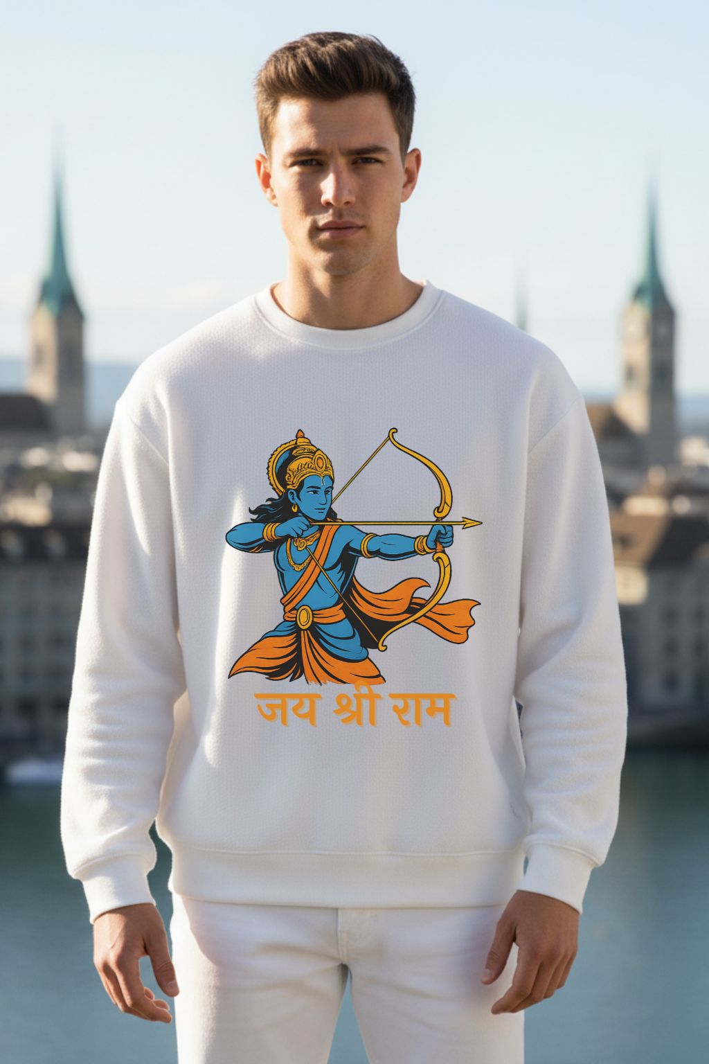 Man wearing a white sweatshirt with a graphic design of Lord Rama and text, standing outdoors.