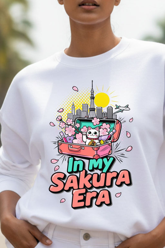 close up view of a woman wearing a white oversized sweatshirt with a colorful graphic design and text 'In my Sakura Era'.