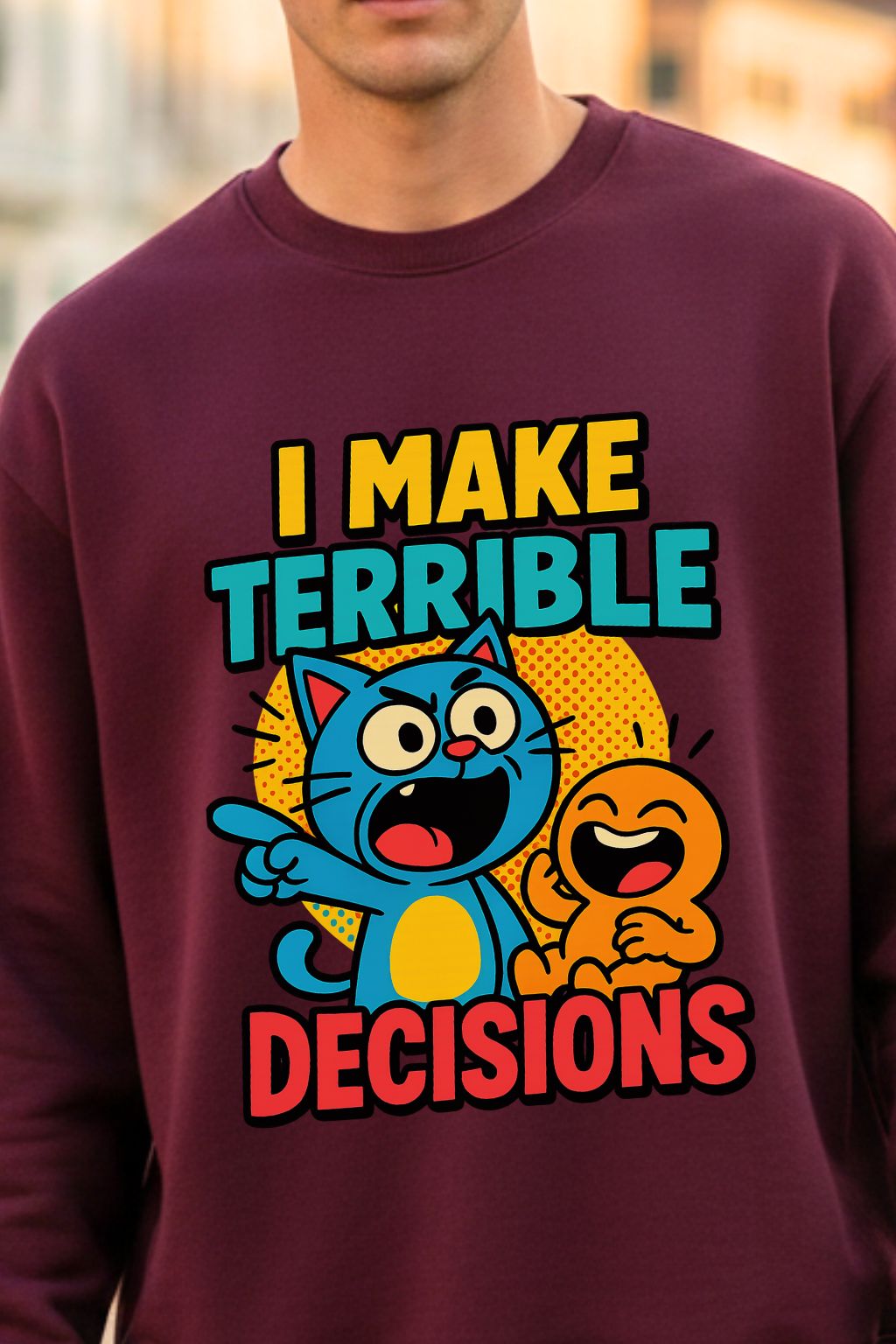 close up view of a maroon oversized sweatshirt with cartoon characters and text 'I Make Terrible Decisions' on a blurred background