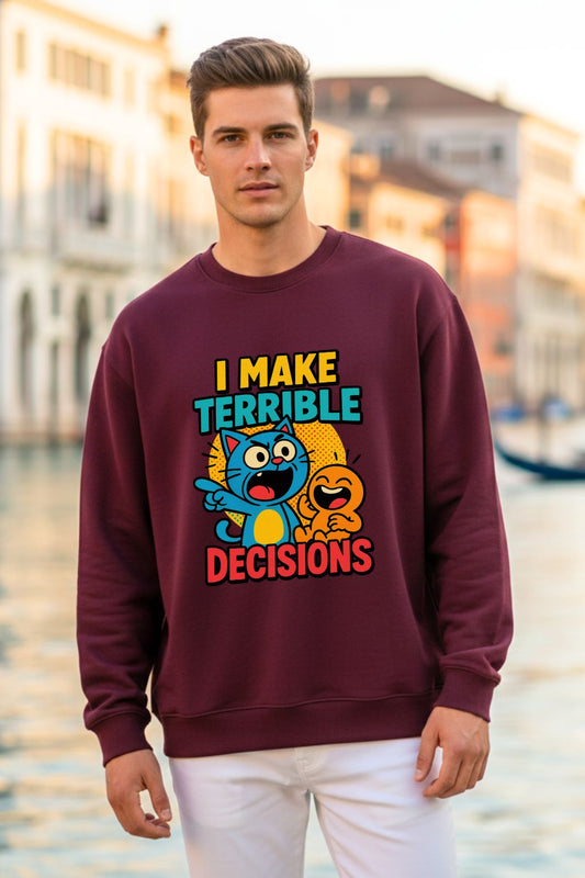 Man wearing a maroon oversized sweatshirt with a colorful graphic and text, standing by a waterfront.