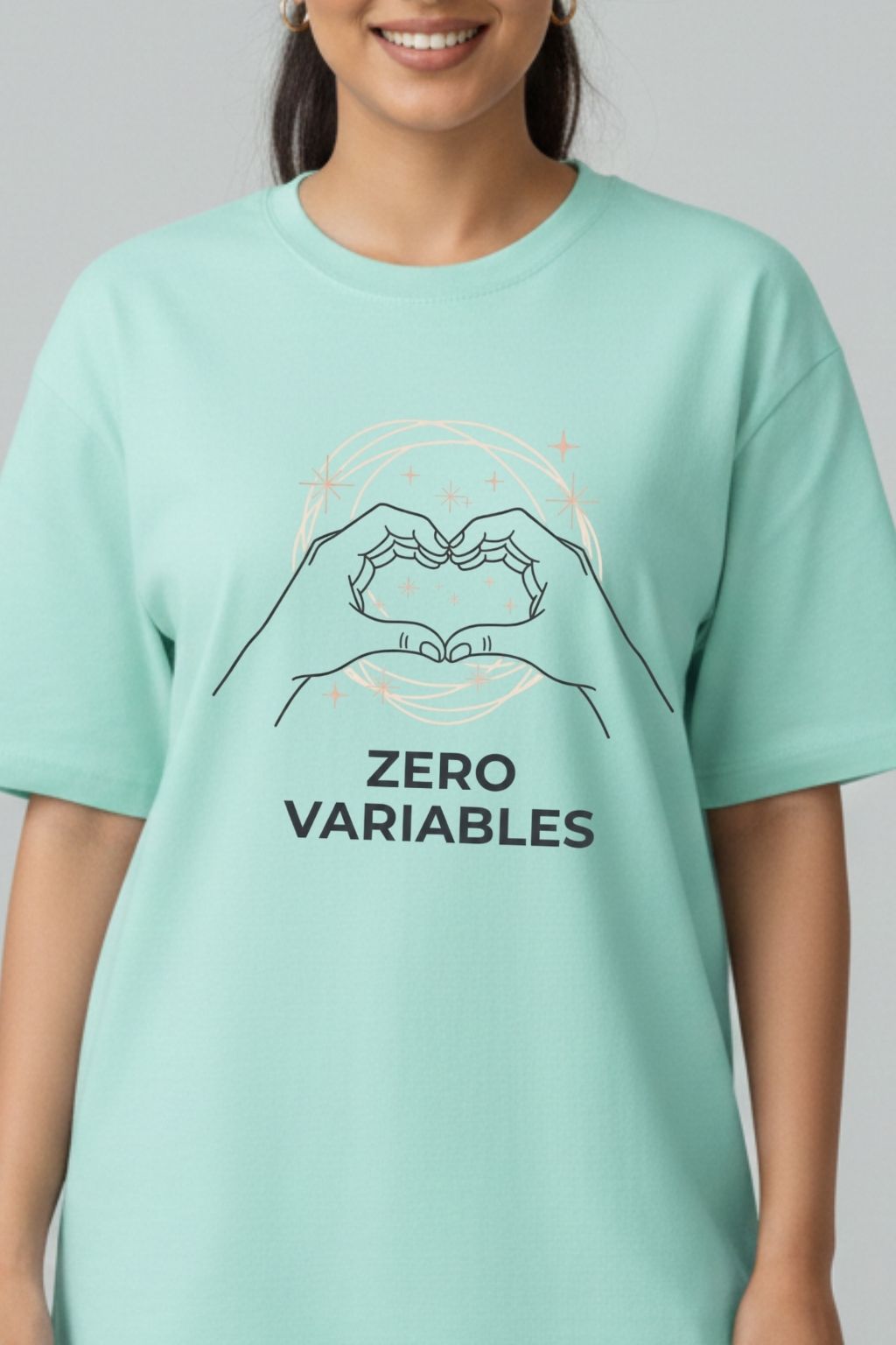 Woman wearing a mint oversized t-shirt with 'ZERO VARIABLES' design on a plain background