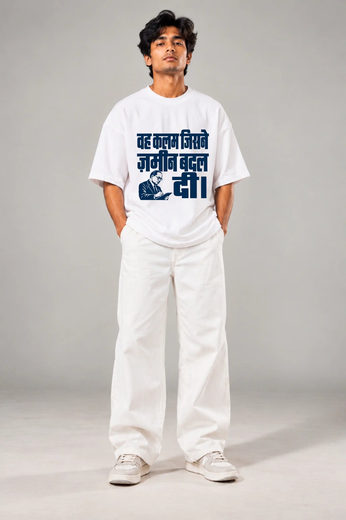 Man in white oversized terry tee with Ambedkar portrait and Hindi print, styled with white trousers | Written in Stone | JUNOSHI