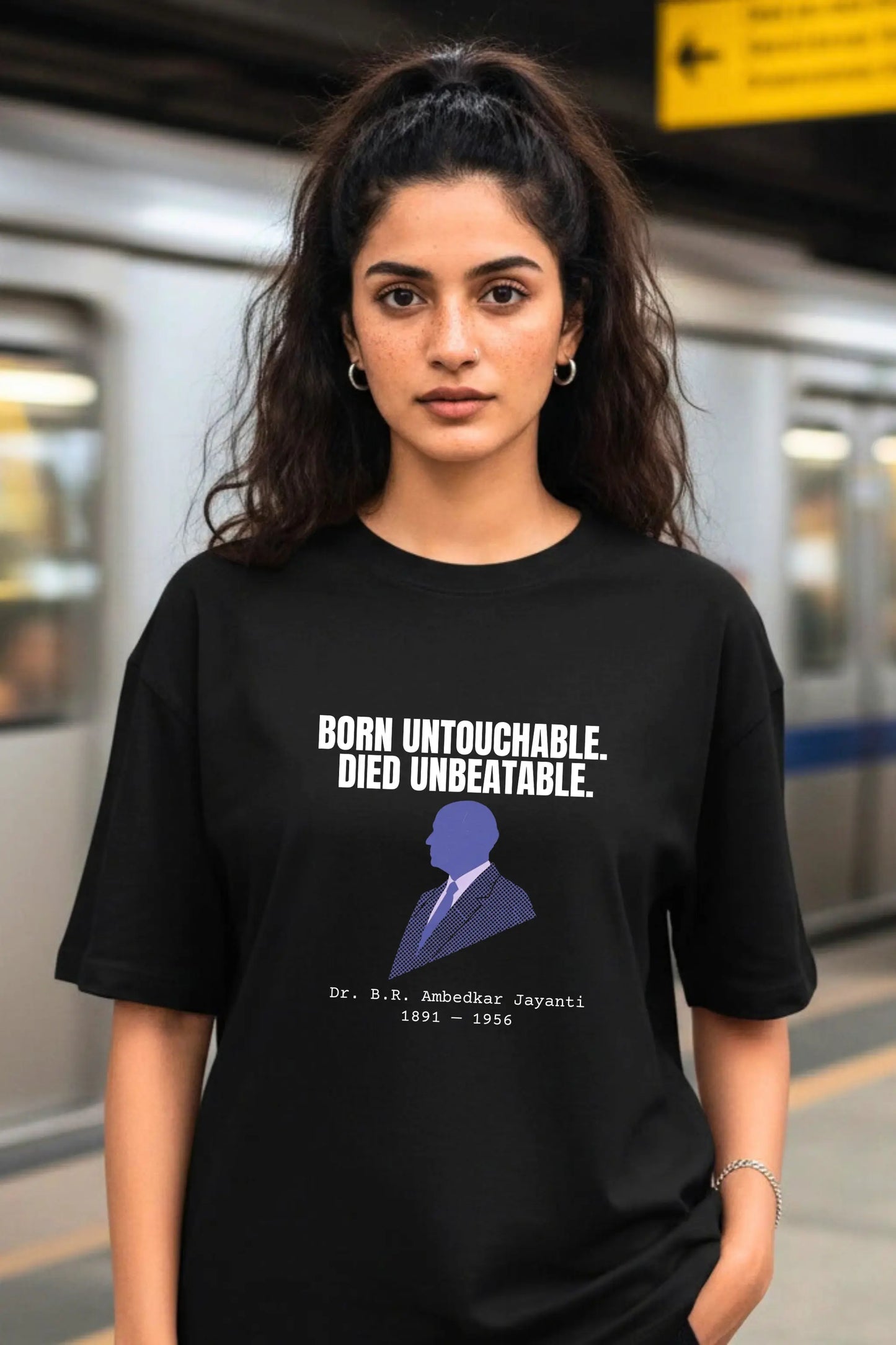 Female model wearing Ambedkar Jayanti oversized tee in Black — streetwear graphic tee by Junoshi