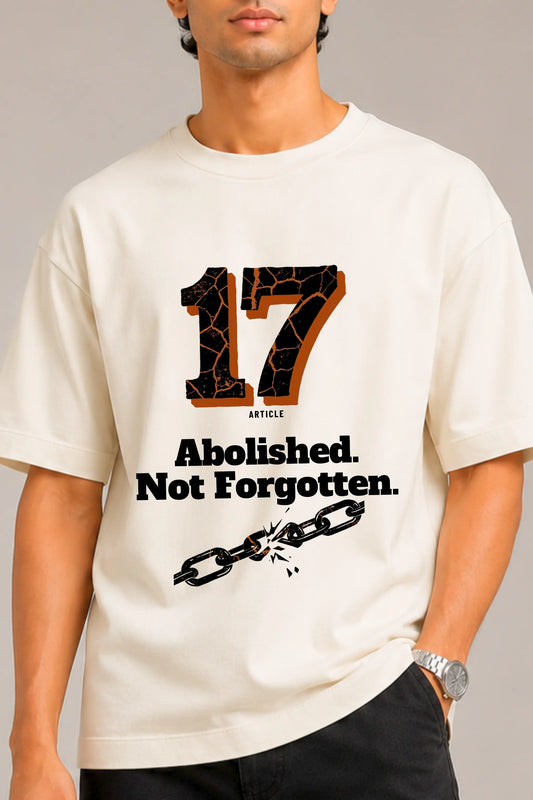 Close-up of Article 17 graphic print with broken chain design on oversized unisex terry tee — JUNOSHI
