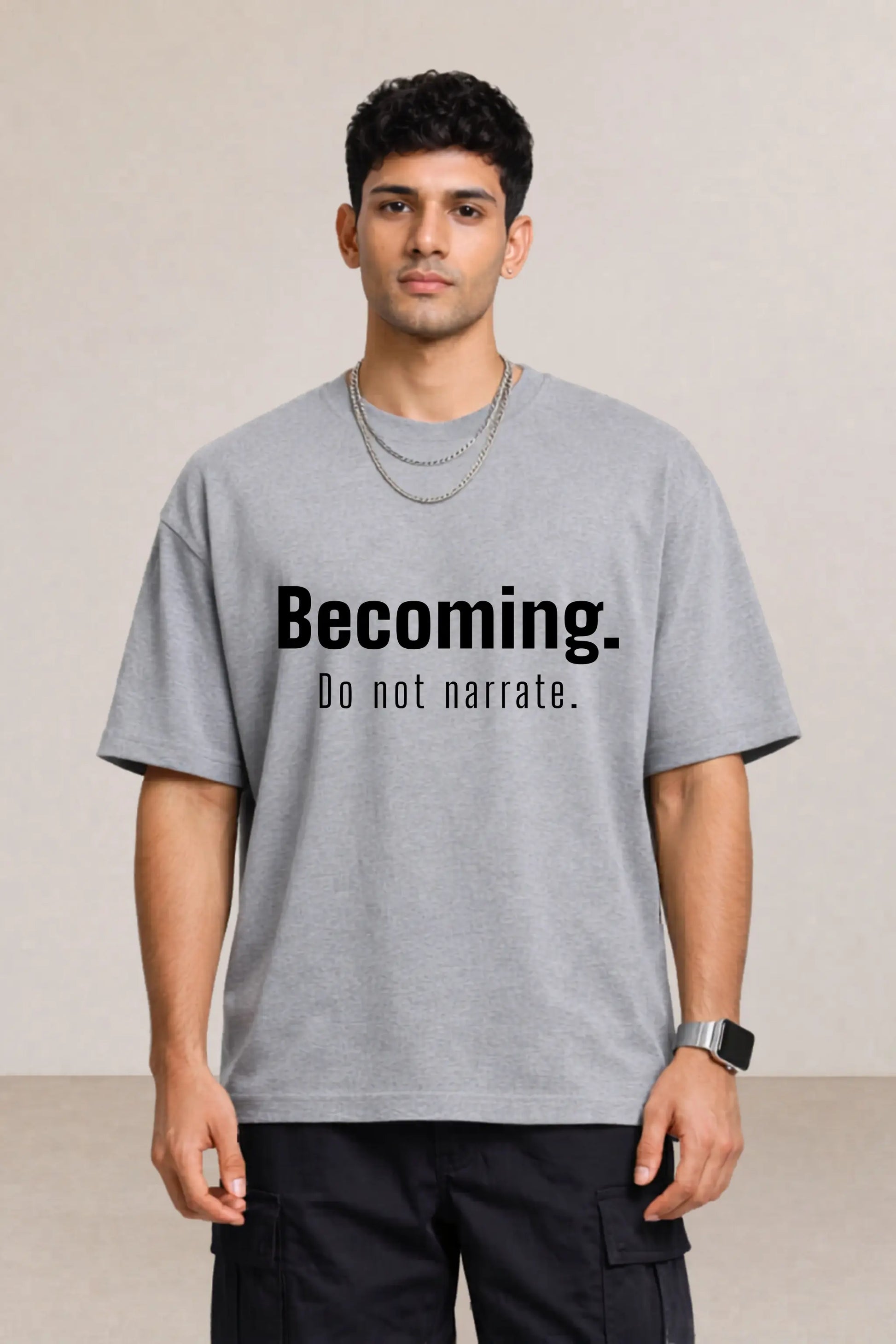 Becoming. Do Not Narrate oversized tee in grey — men's chest close-up, bold typography streetwear tee for men India | JUNOSHI