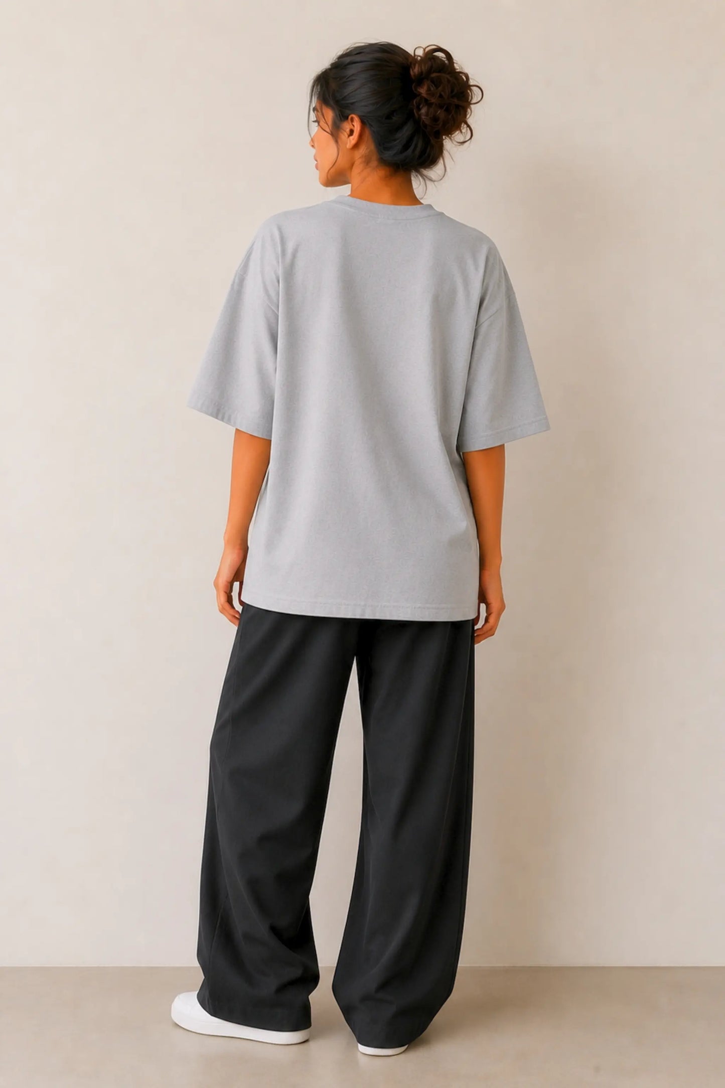 Back view of Becoming. Do Not Narrate grey oversized tee — relaxed unisex fit, dropped shoulders, streetwear silhouette | JUNOSHI