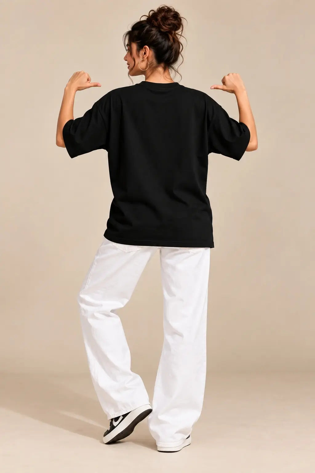 Back view of black oversized terry t-shirt on woman, plain back with drop shoulder fit | JUNOSHI