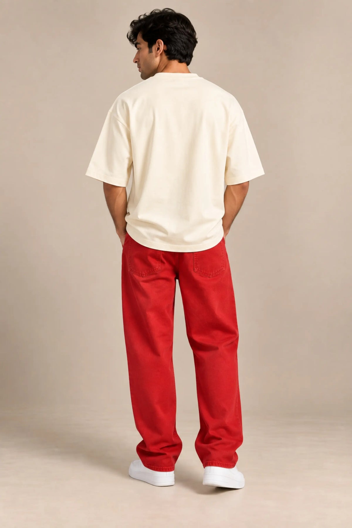 Back view of off-white Cam On Vietnam oversized terry t-shirt with plain back, worn with red jeans | JUNOSHI