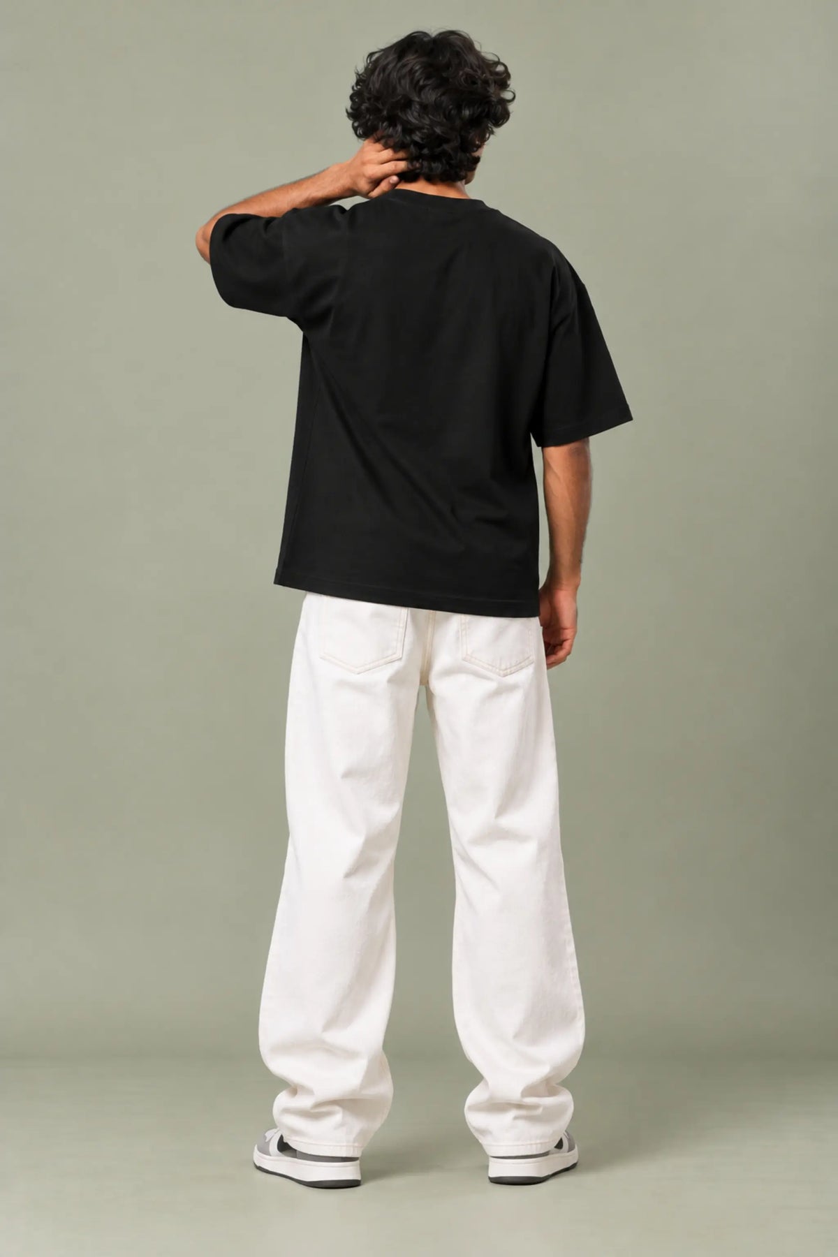 Chaya Thanuthu — Plain back of black unisex oversized t-shirt with drop shoulder fit | JUNOSHI