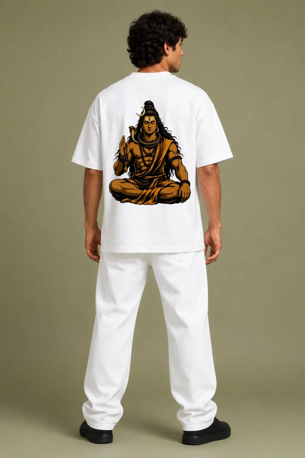Dakshinamurthy Shiva oversized tee back print worn by man featuring meditating Shiva with cobra and rudraksha — Divine Street stillness