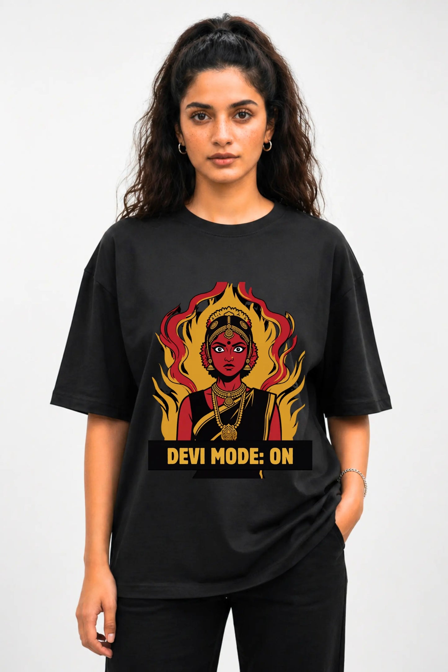Devi Mode On anime oversized tee in black — front view with Desi manga Devi graphic, worn by a woman | JUNOSHI