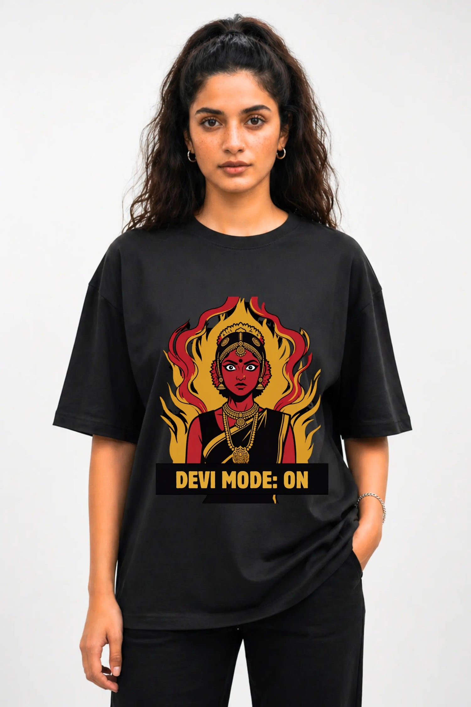 Devi Mode On anime oversized tee in black — front view with Desi manga Devi graphic, worn by a woman | JUNOSHI