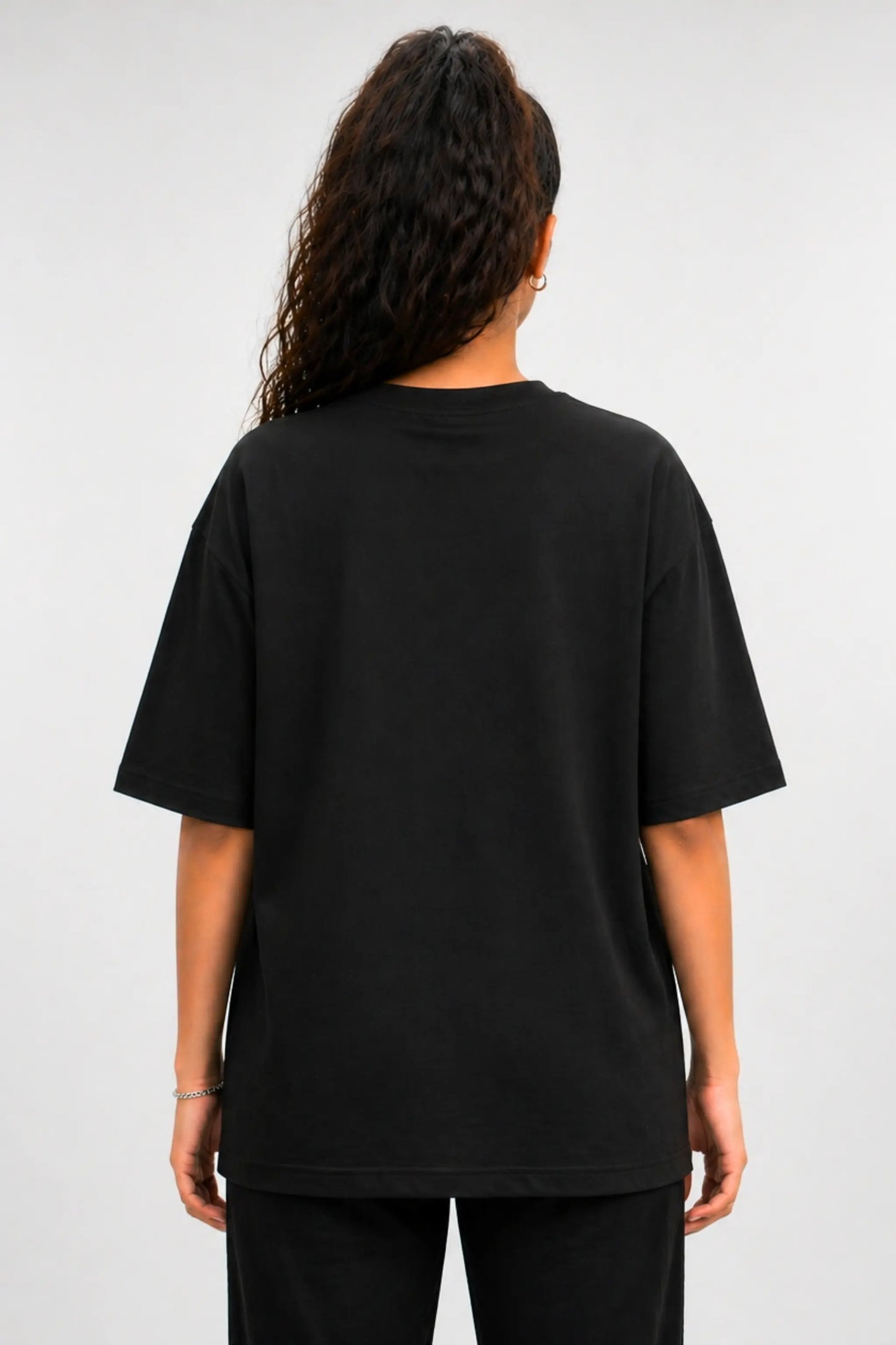 Back view of Devi Mode On black oversized Terry tee — clean back, unisex fit | JUNOSHI