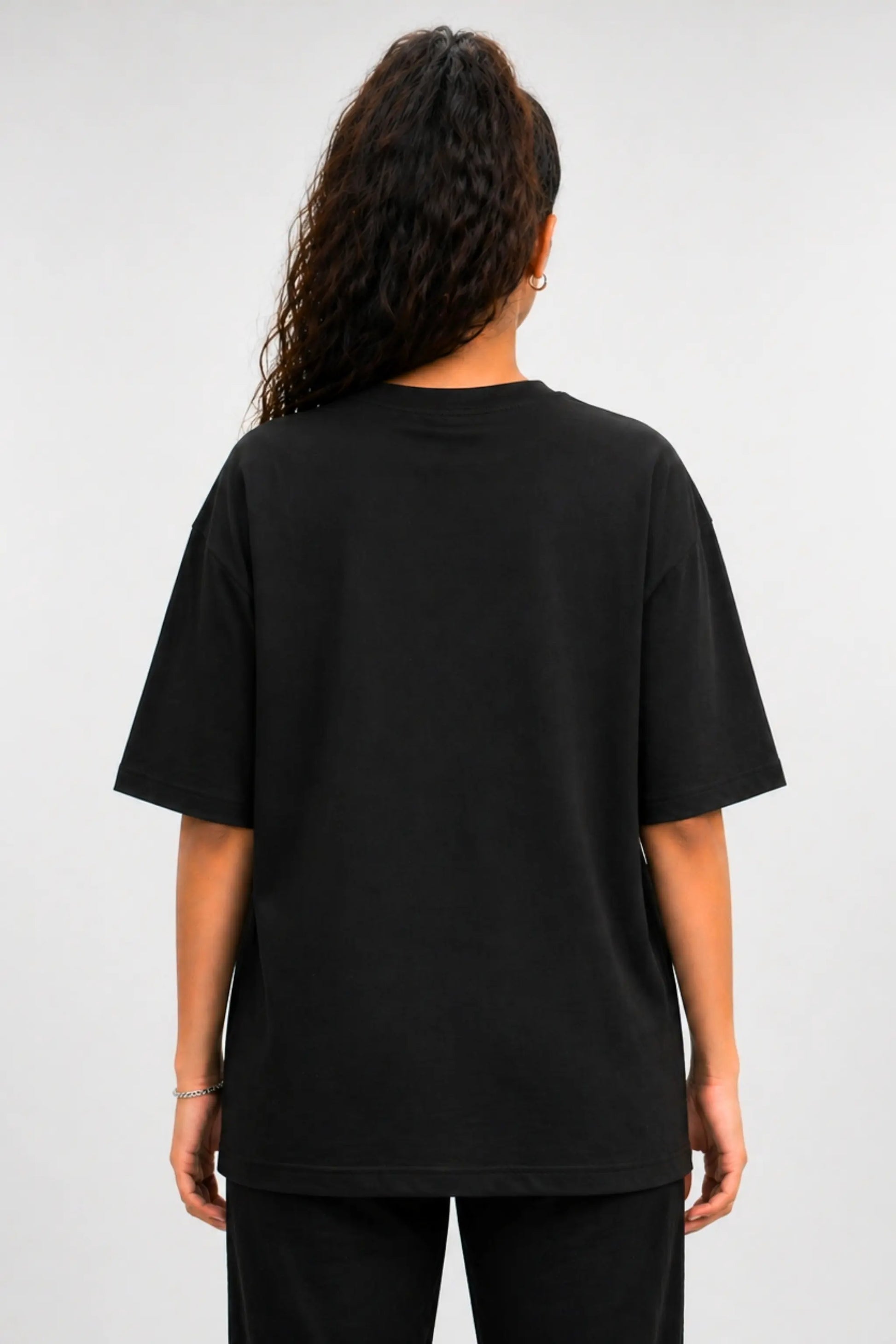 Back view of Devi Mode On black oversized Terry tee — clean back, unisex fit | JUNOSHI