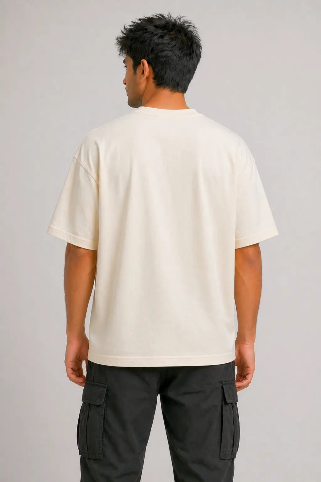 Back view of Fold Gang cream oversized tee — unisex drop-shoulder fit, clean back, styled with cargo pants | JUNOSHI Pet Pawtrait Collection