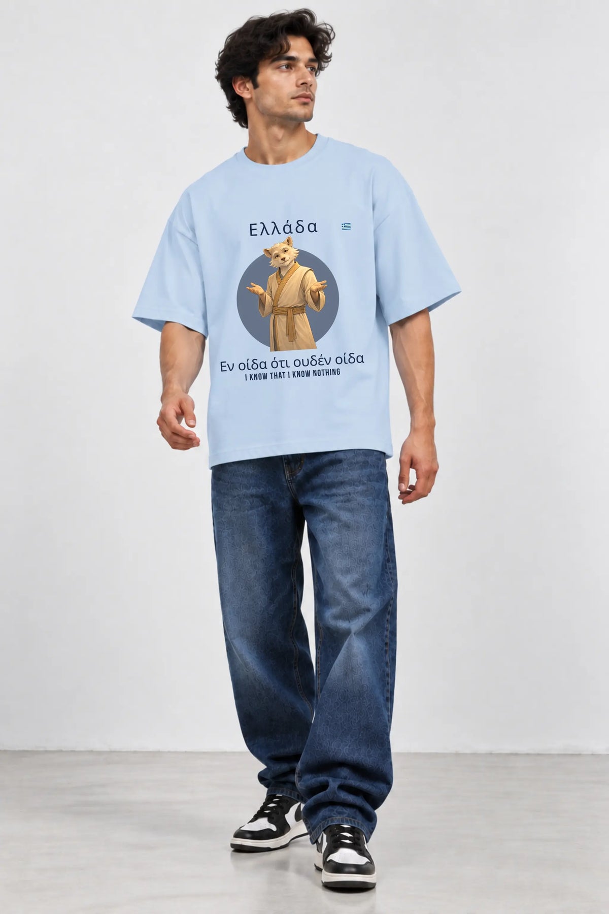 I Know Nothing Greek: Curious Humility Oversized Terry T-Shirt, Front View on Male Model | JUNOSHI