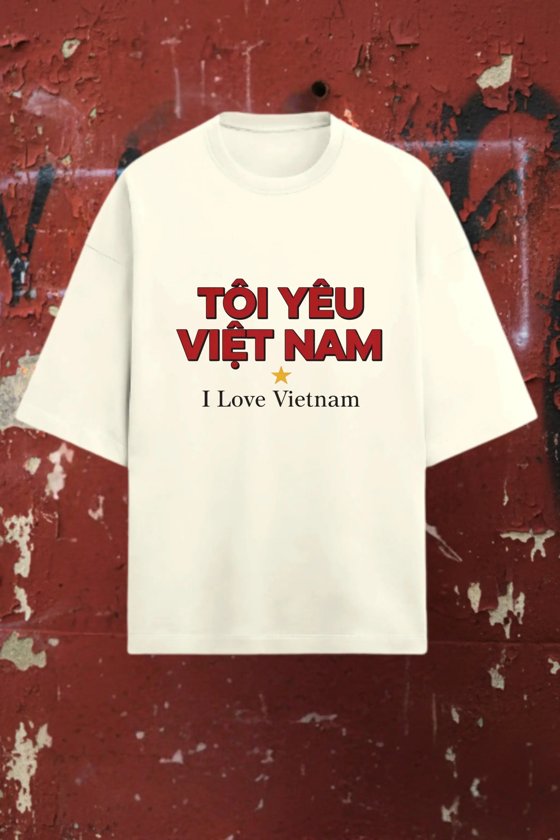 Flat lay of I Love Vietnam off-white oversized terry t-shirt on red textured background — premium DTF print travel tee | JUNOSHI