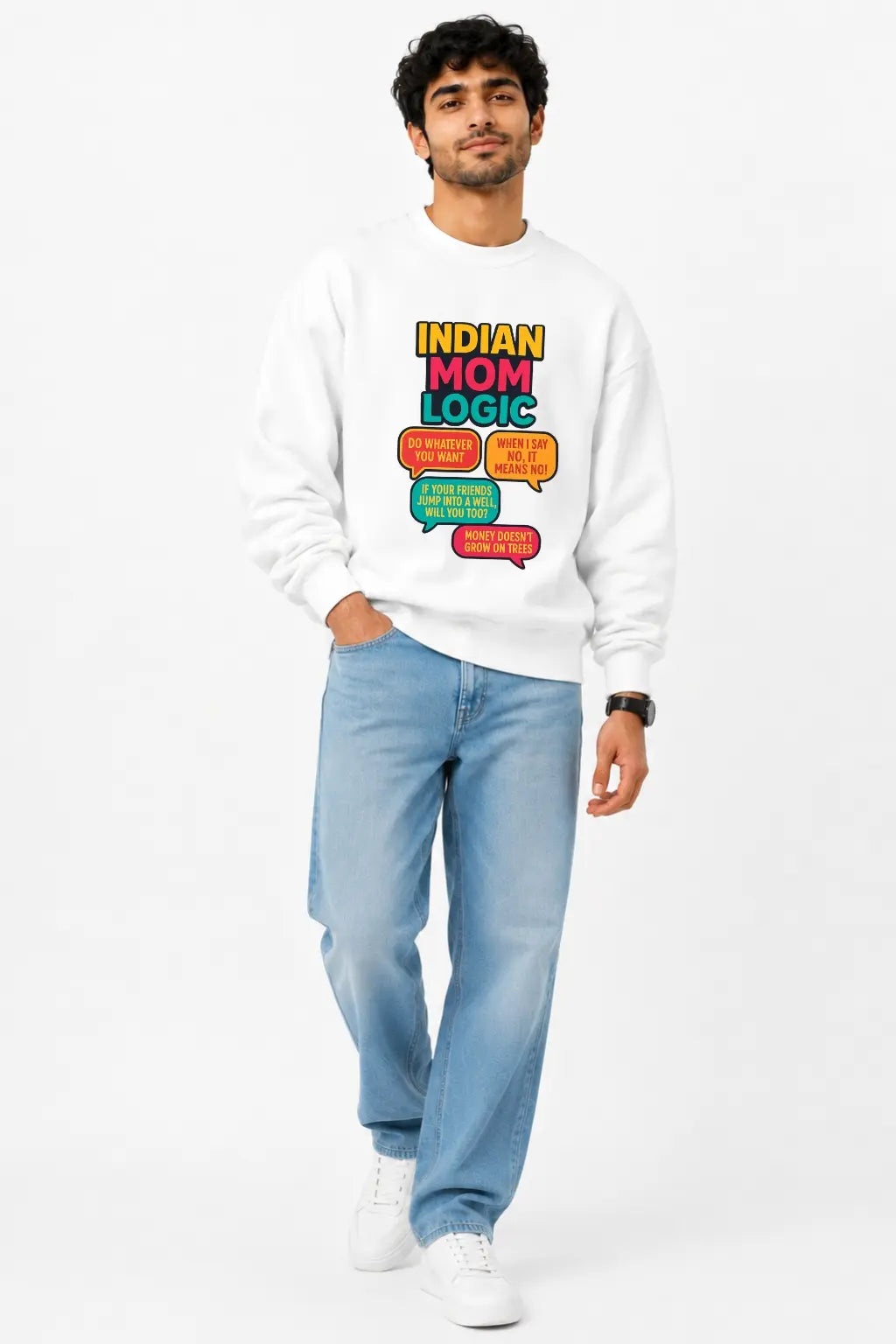 Man in white Indian Mom Logic sweatshirt paired with light blue jeans, full-length look