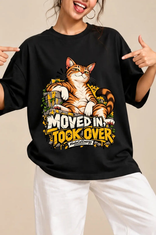 Close-up of Moved In Took Over #IndieCatEnergy DTF cat print on black unisex oversized terry t-shirt | JUNOSHI